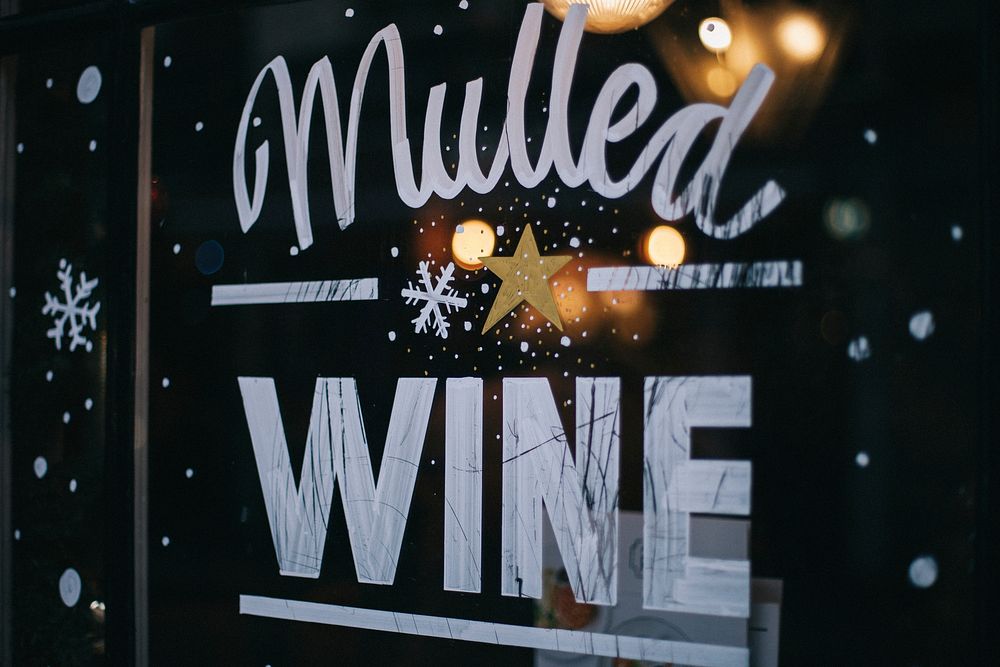 An artwork reading “mulled wine” on a glass window of a store in Soho. Original public domain image from Wikimedia Commons