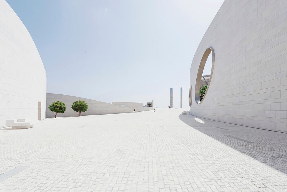 Clean white exterior of a building. Original public domain image from Wikimedia Commons