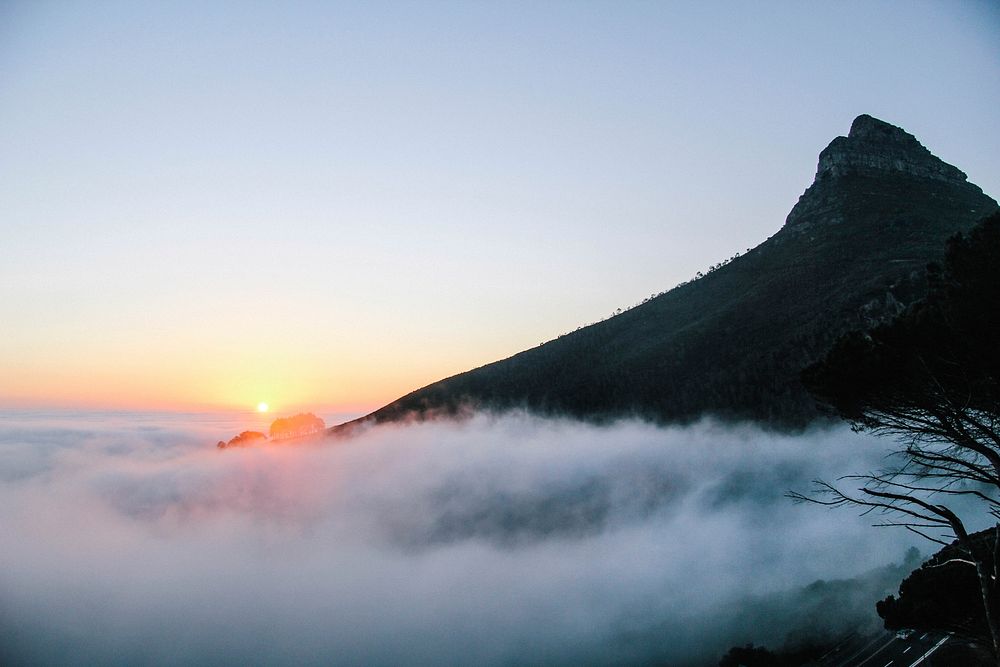 Foggy sunset below peak during dusk in Cape Town. Original public domain image from Wikimedia Commons