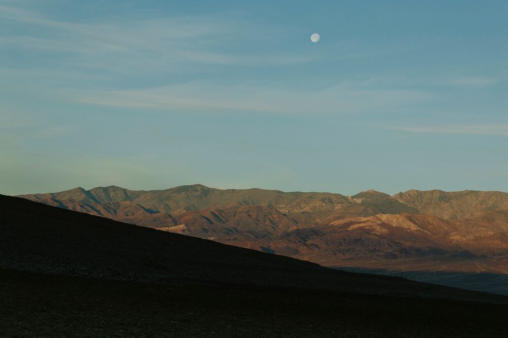 The moon over the hill in the Death Valley National Park. Original public domain image from Wikimedia Commons