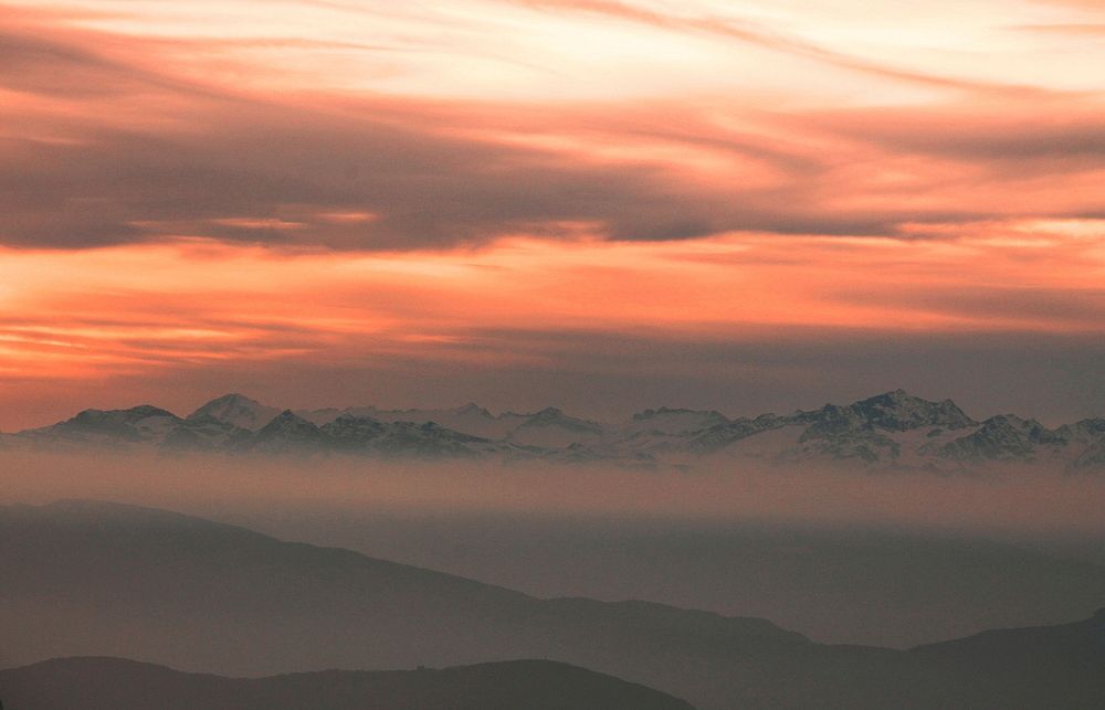 Shades of orange sunset above mountains in Ortisei. Original public domain image from Wikimedia Commons