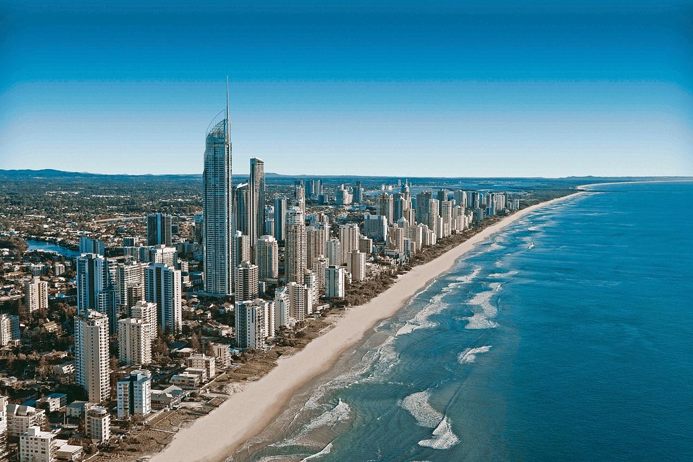 A long sandy coast with high-rises and skyscrapers. Original public domain image from Wikimedia Commons