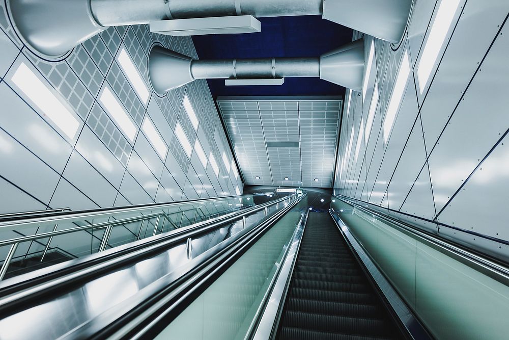 An empty staircase and an escalator at a subway station in Cologne. Original public domain image from Wikimedia Commons