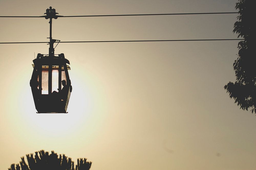 Side view of a cable car silhouette.. Original public domain image from Wikimedia Commons