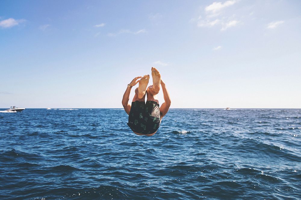 Man doing somersault in the ocean at Emerald Bay. Original public domain image from Wikimedia Commons