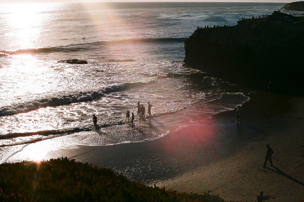 People entering the ocean from the bay in Santa Cruz. Original public domain image from Wikimedia Commons