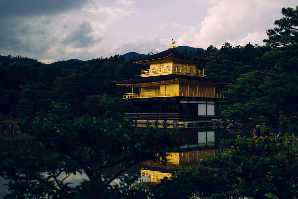 Golden temple next to pond in the middle of forest in Kinkaku-ji. Original public domain image from Wikimedia Commons