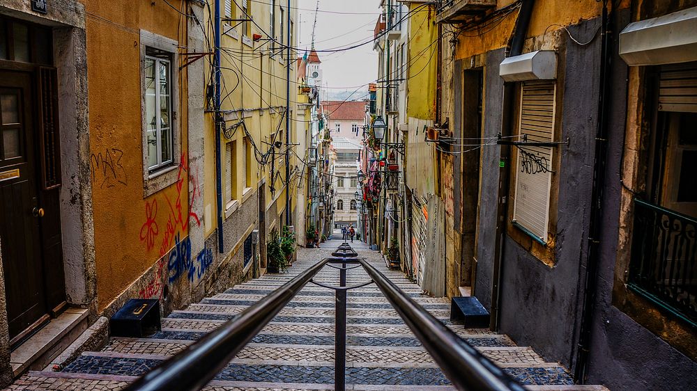 A staircase leading down an alley in Lisbon. Original public domain image from Wikimedia Commons