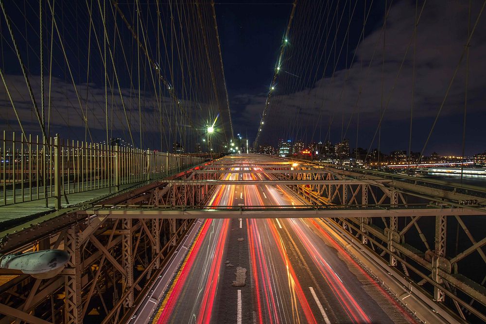 A night-time shot of the Brooklyn Bridge with eccentric traffic light trails. Original public domain image from Wikimedia…