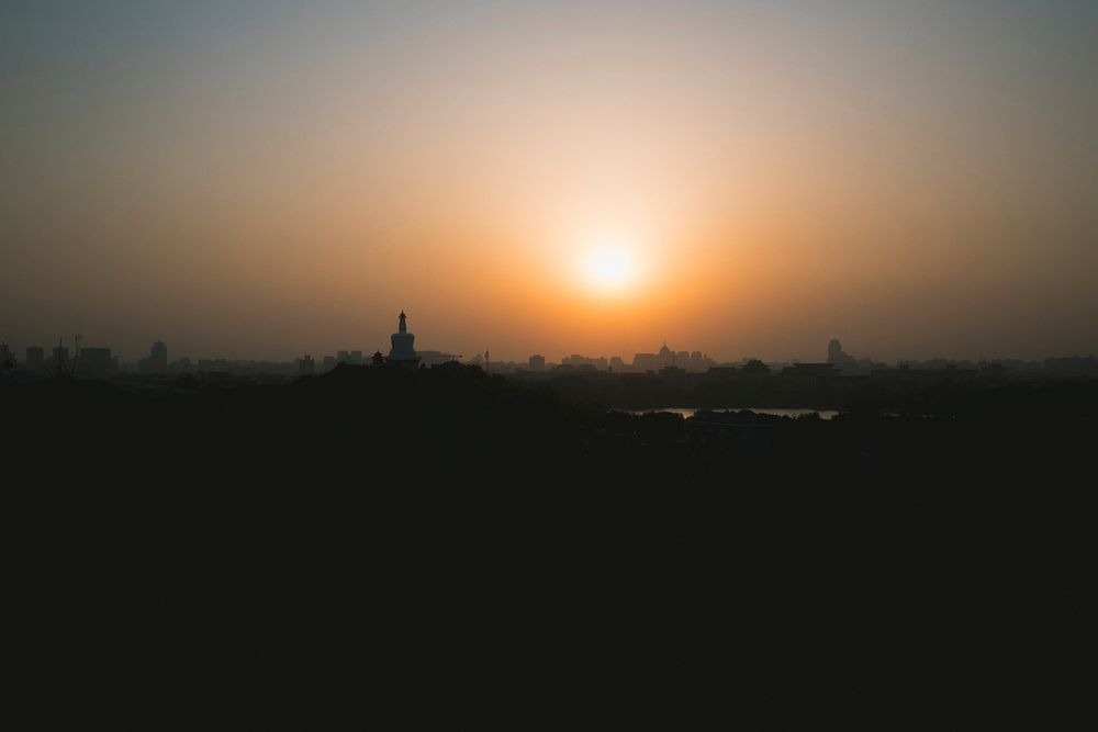 Hazy sunset against the horizon at Jinghsan Park.. Original public domain image from Wikimedia Commons