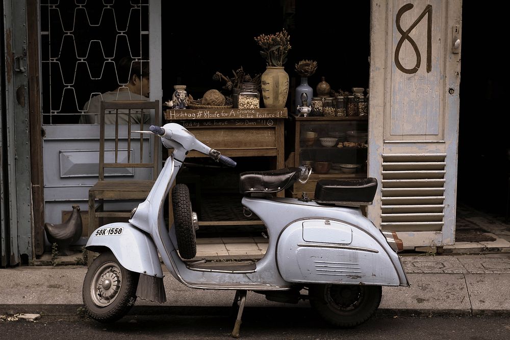 Old scooter parked on the street. Original public domain image from Wikimedia Commons