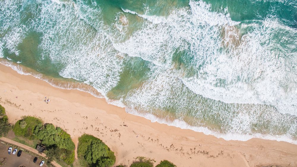 Ocean washing beach sand shore, Kauai Beach, Hawaii. Original public domain image from Wikimedia Commons