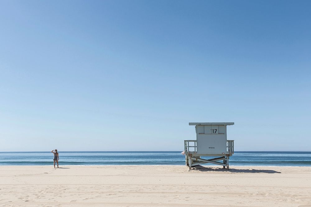 Lifeguard stand in tranquil beach photo of ocean and shoreline in a summer day. Original public domain image from Wikimedia…