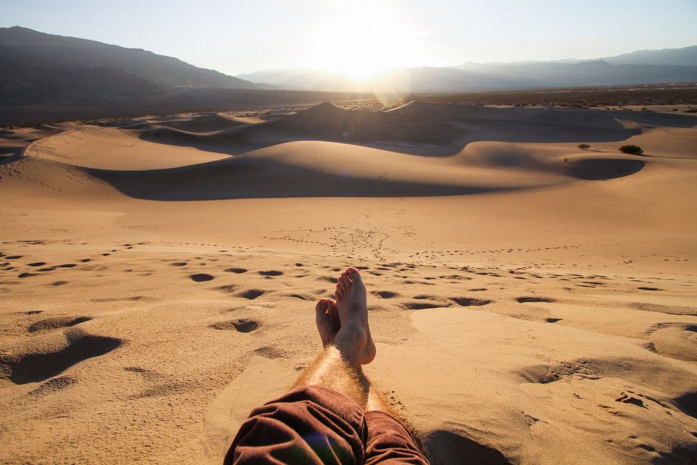 Lounging in Death Valley National Park desert sand. Original public domain image from Wikimedia Commons