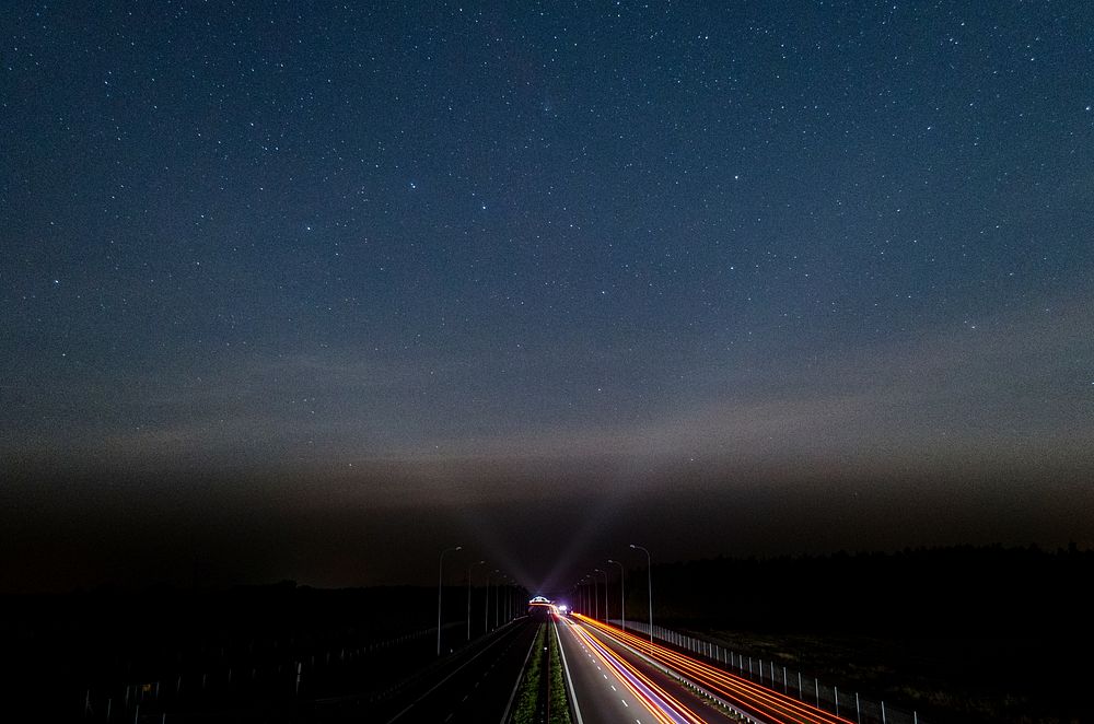 NIght time long exposure photography of a traffic. Original public domain image from Wikimedia Commons