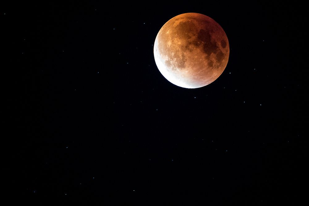 Lunar eclipse, supermoon, night sky. Original public domain image from Wikimedia Commons