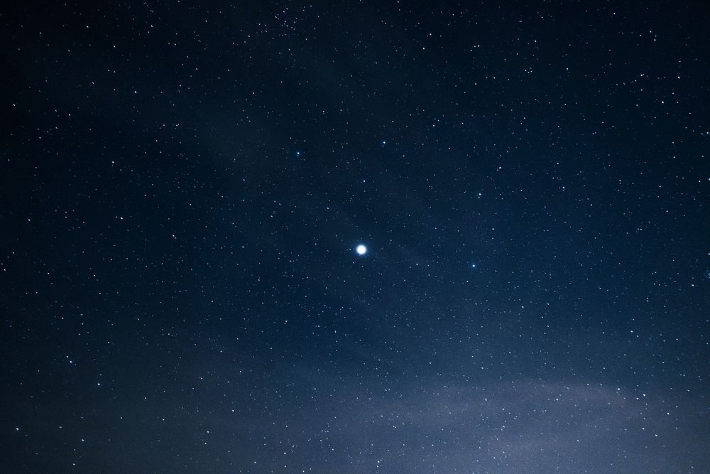 In the night sky full of stars stands a bright lone star. Original public domain image from Wikimedia Commons