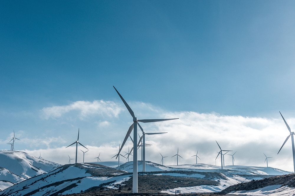 A wind farm on snowy hills in Greece. Original public domain image from Wikimedia Commons