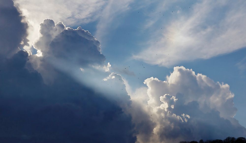 Clouds with sun rays. Original public domain image from Wikimedia Commons