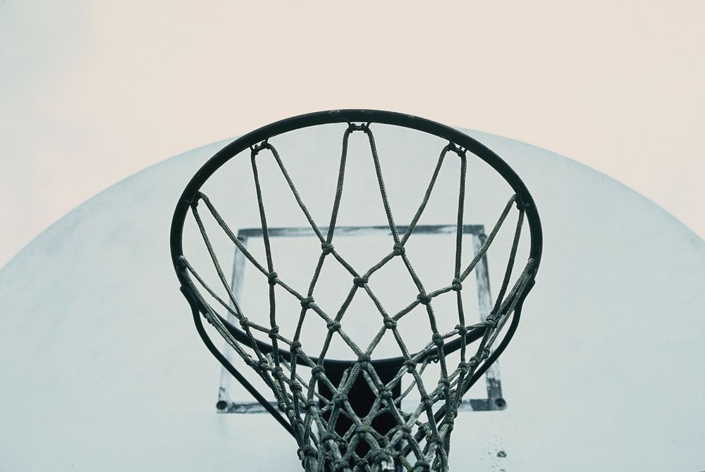 A macro shot from underneath a basketball hoop in on outdoor court in Long Grove. Original public domain image from…