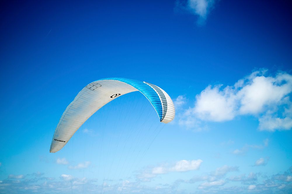 Blue and white paragliding in Dune of Pilat, La Teste-de-Buch, France. Original public domain image from Wikimedia Commons