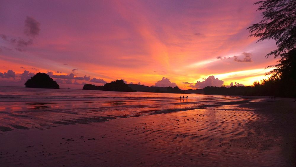 Purple sunset beach, clouds, rocks. Original public domain image from Wikimedia Commons