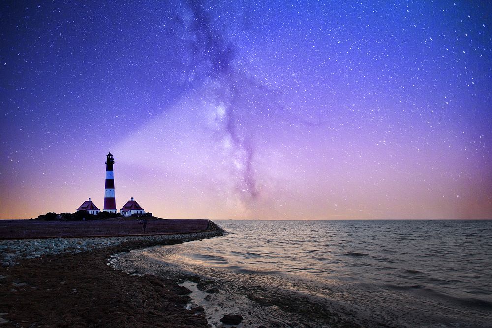 Lighthouse with purple starry sky. Original public domain image from Wikimedia Commons