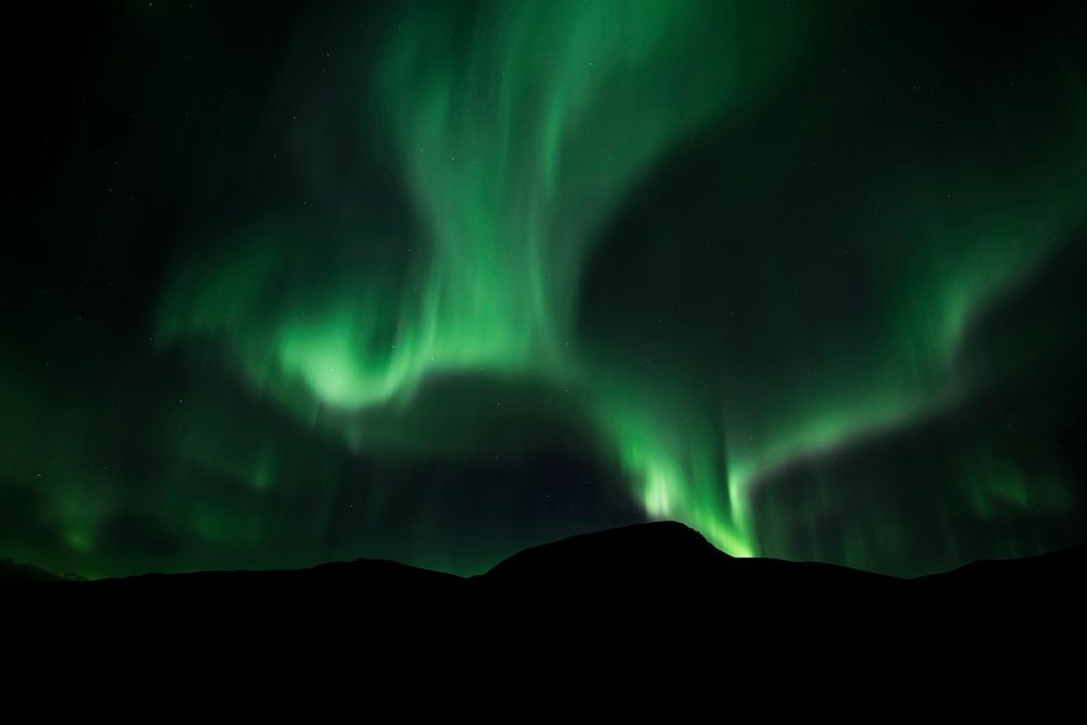 Aurora Borealis, beautiful nature background. Original public domain image from Wikimedia Commons