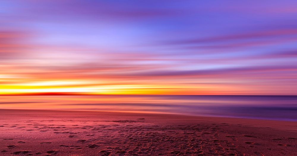 Beach with purple orange sunset. Original public domain image from Wikimedia Commons