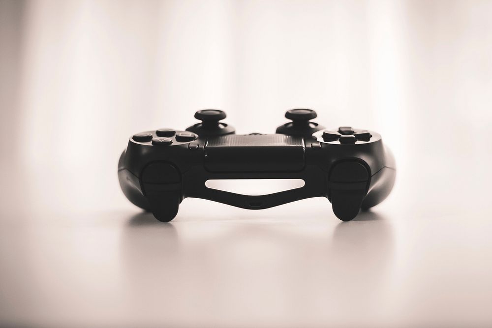 New video game controller over exposed with a bright lit background. Original public domain image from Wikimedia Commons