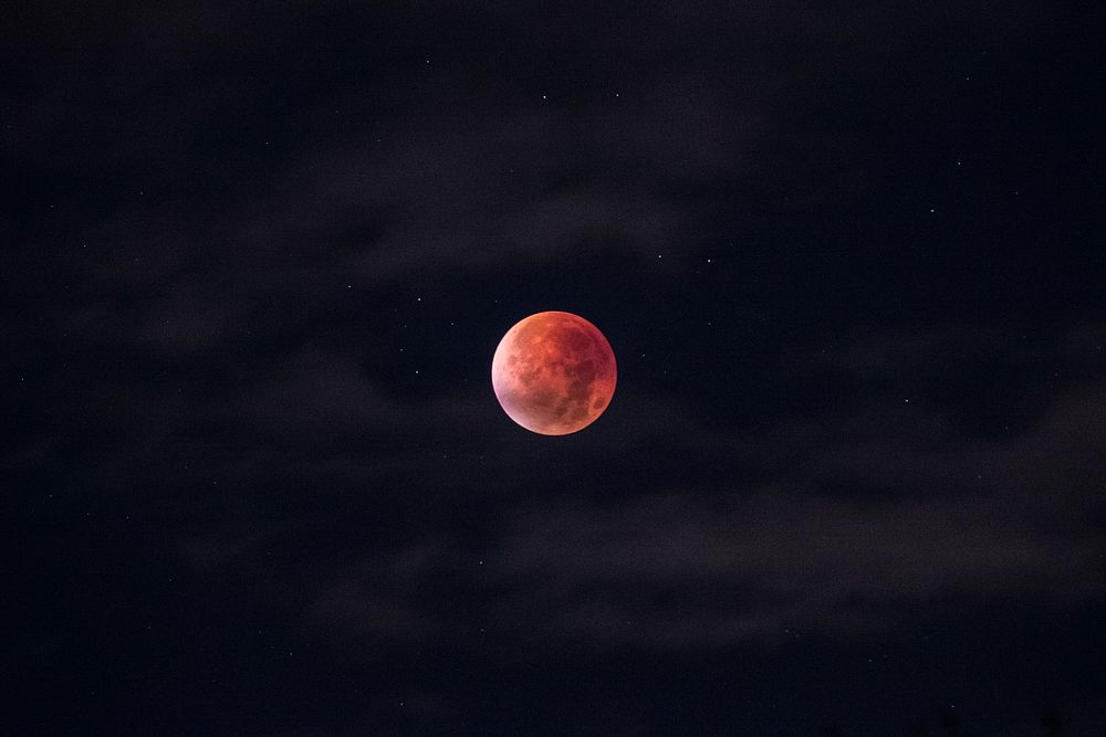 A blood moon on the sky of Stockholm on account of the lunar eclipse. Original public domain image from Wikimedia Commons