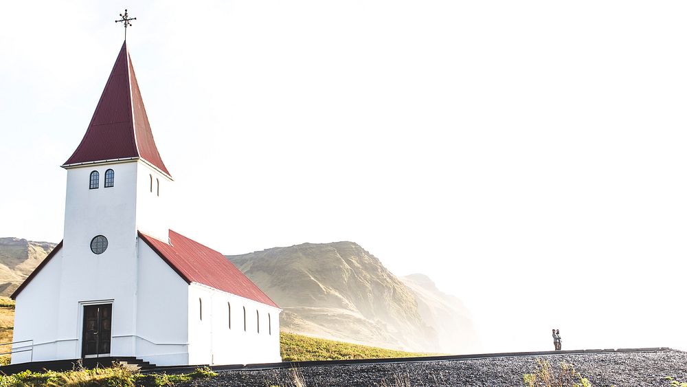 Quaint chapel in a field near mountains. Original public domain image from Wikimedia Commons