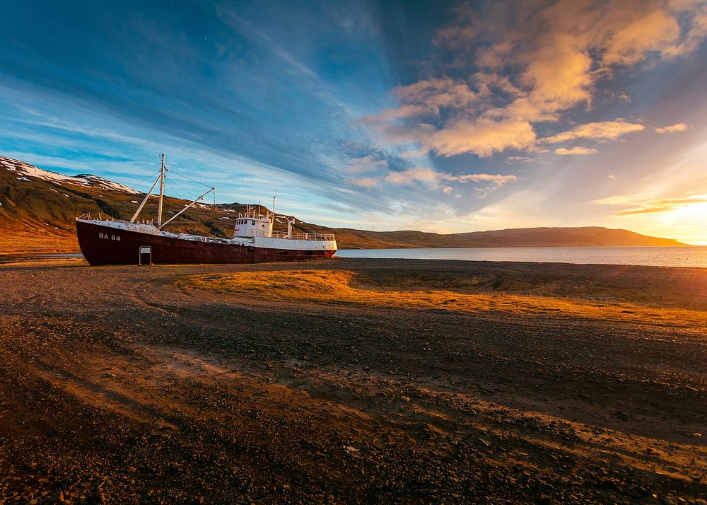 Shipwreck by the shore during sunset. Original public domain image from Wikimedia Commons