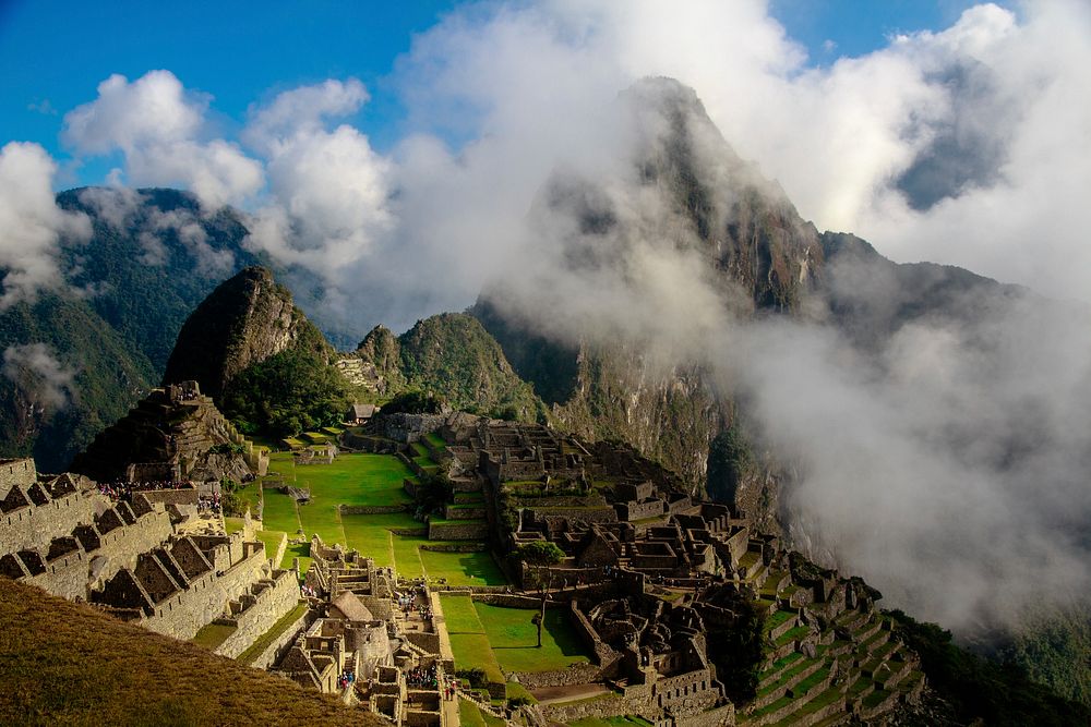 Aerial view of Machu Picchu on a cloudy day. Original public domain image from Wikimedia Commons