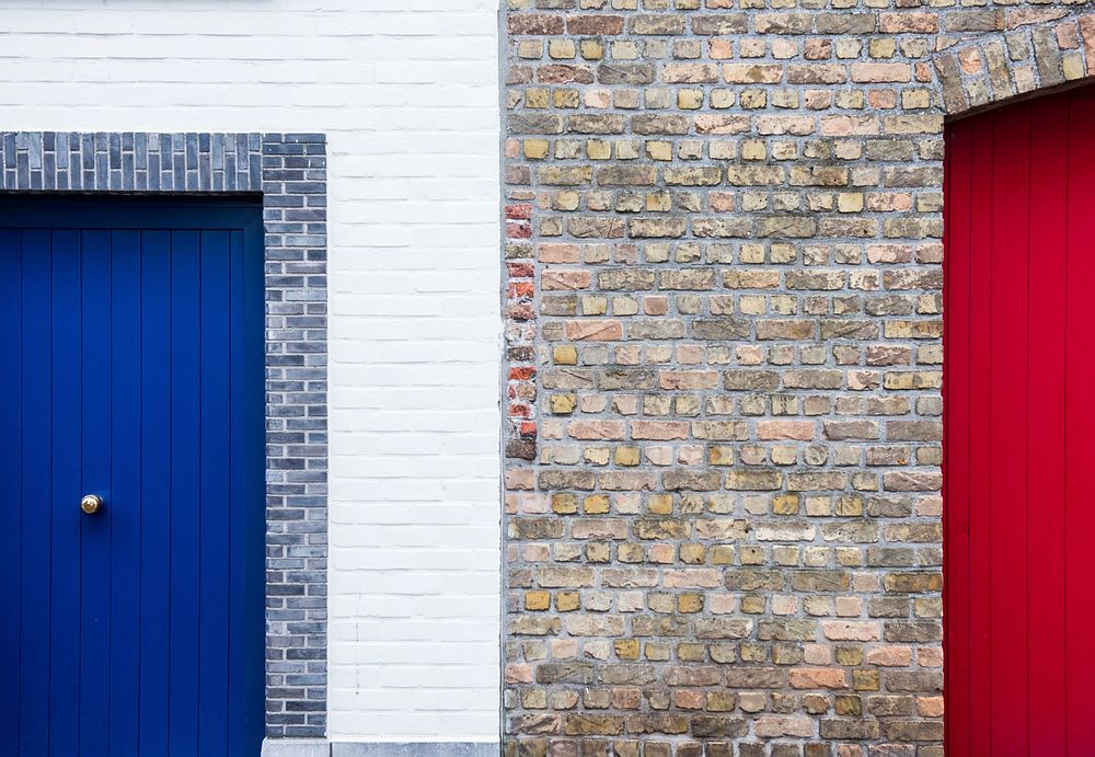 Blue wooden door in brick wall. Original public domain image from Wikimedia Commons