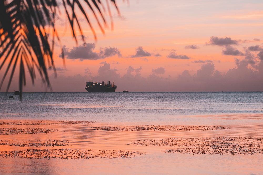 Tropical beach at sunset, cruise. Original public domain image from Wikimedia Commons