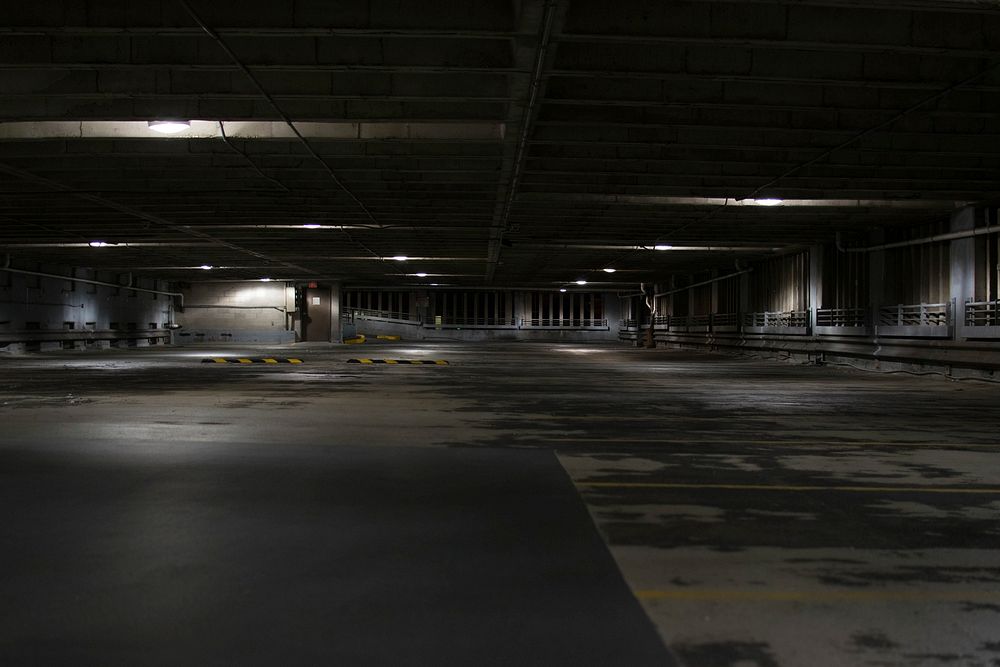 A dark empty concrete parking space in Milwaukee. Original public domain image from Wikimedia Commons