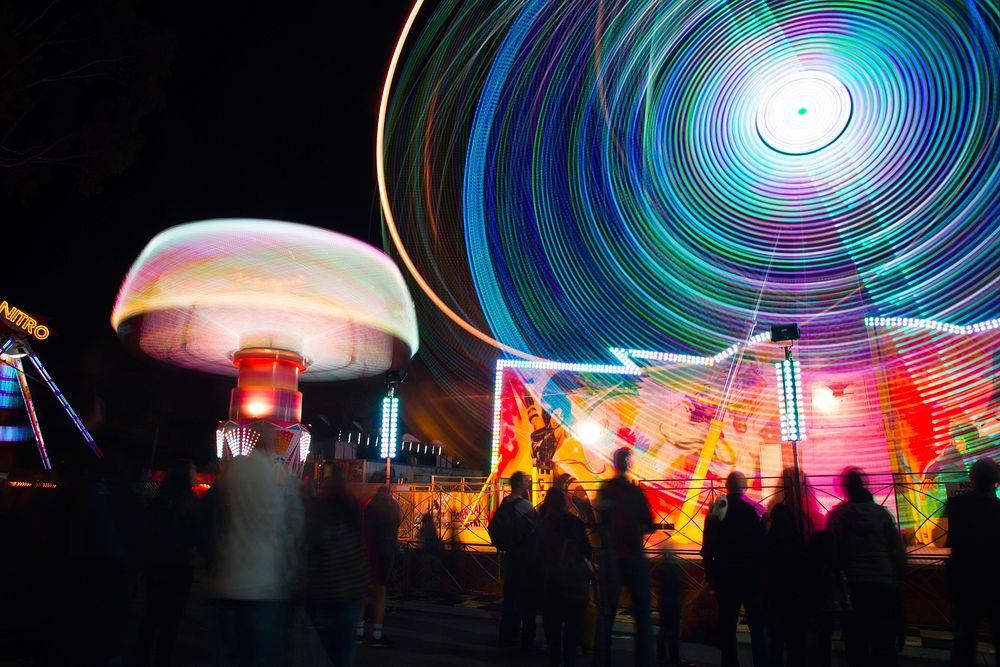 A ride at an amusement park with light trails, plus the Perth Royal Show crowd. Original public domain image from Wikimedia…