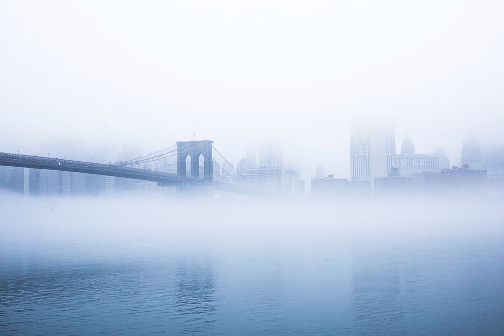 New York Brooklyn Bridge covered by fog. Original public domain image from Wikimedia Commons