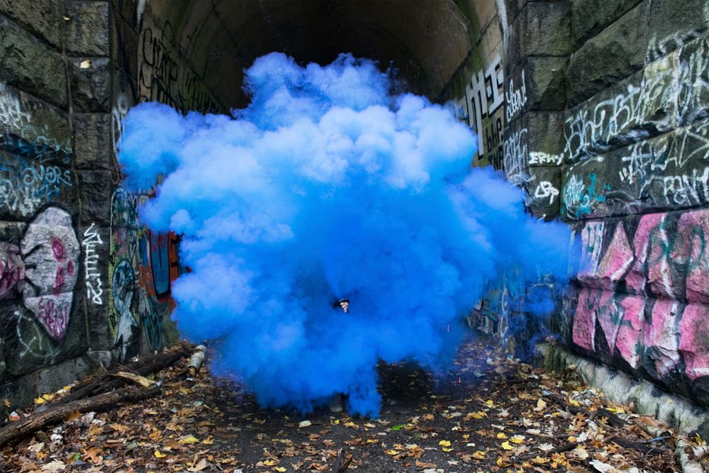 Blue smoke in graffiti alley. Original public domain image from Wikimedia Commons