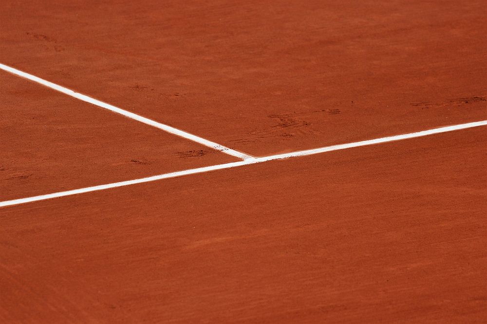 The view of a white tennis line markings on a tennis court. Original public domain image from Wikimedia Commons