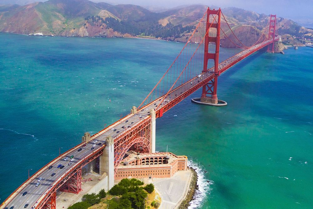 An aerial view of the Golden Gate Bridge in San Francisco on a sunny day. Original public domain image from Wikimedia Commons