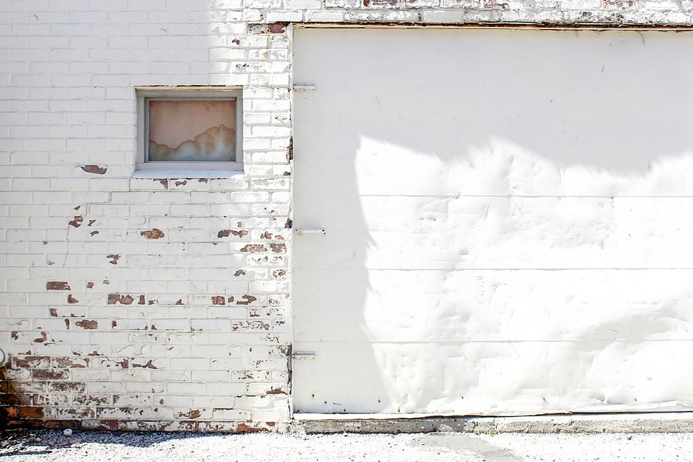 White wall and garage door. Original public domain image from Wikimedia Commons