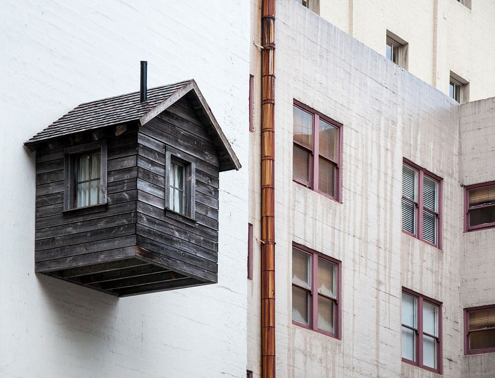 Wooden shed cabin stuck on apartment wall in Sutter Street. Original public domain image from Wikimedia Commons