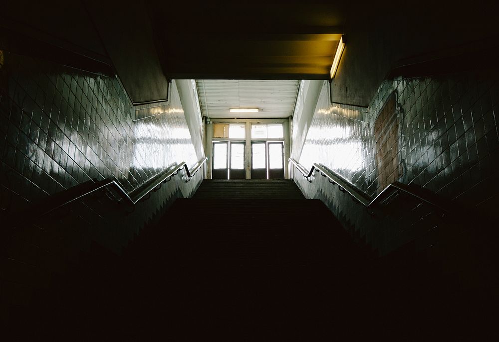 Dark stairwell with light at the top. Original public domain image from Wikimedia Commons