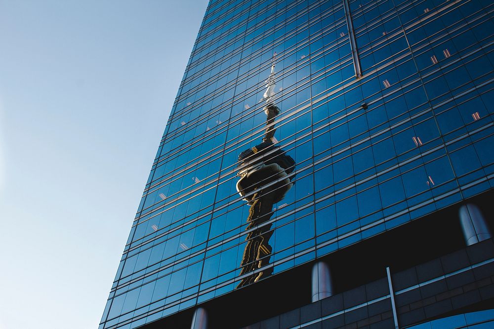 Reflection of CN tower on glass skyscraper windows in daytime, Toronto. Original public domain image from Wikimedia Commons