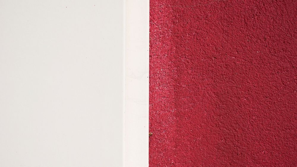 A straight line dividing parts of a wall painted white and red. Original public domain image from Wikimedia Commons
