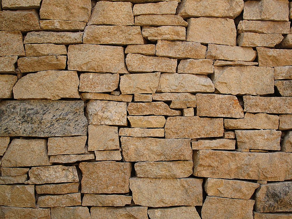 A stone rock wall. Original public domain image from Wikimedia Commons