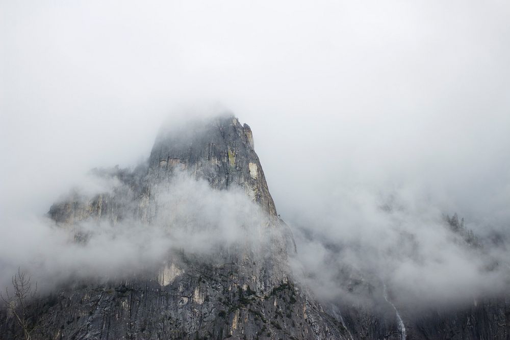 Rocky mountain peak in Yosemite on a foggy day. Original public domain image from Wikimedia Commons