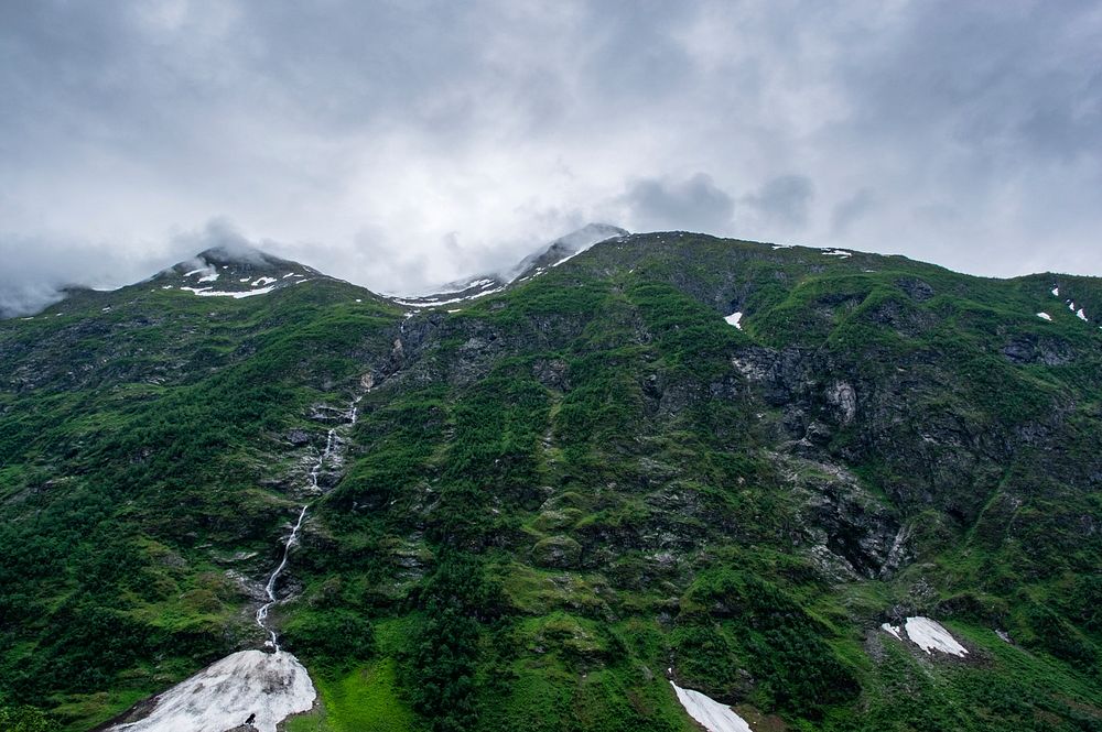 Grassy mountainside with waterfalls in Geiranger. Original public domain image from Wikimedia Commons